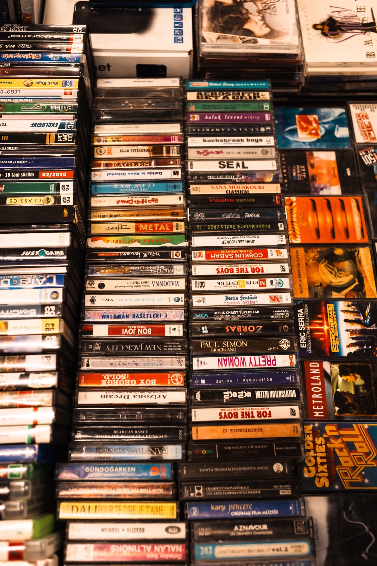 A collection of cassette tapes arranged like a shelf of recorded stories.